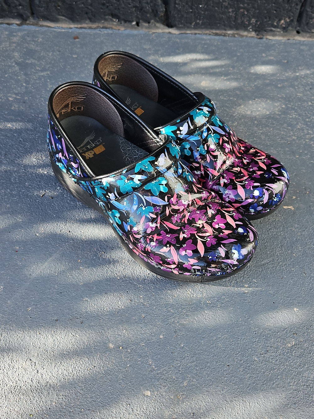 Dansko Women's Black Patent Clogs with Teal, Purple & Pink Floral Print